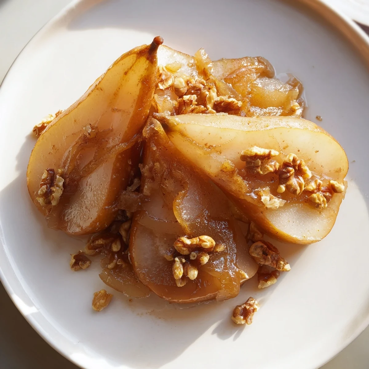 Warm Maple-Warm Cozy Plate: Caramelized Pear and Walnut Bake glistens, showcasing tender pears and crunchy walnuts in sweet sauce.
