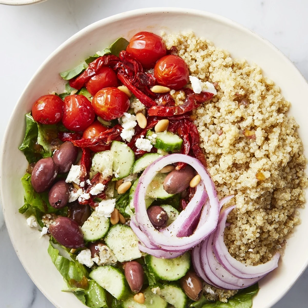 Enjoy a close-up of a fresh and healthy Mediterranean Grain Bowl with colorful ingredients visible.