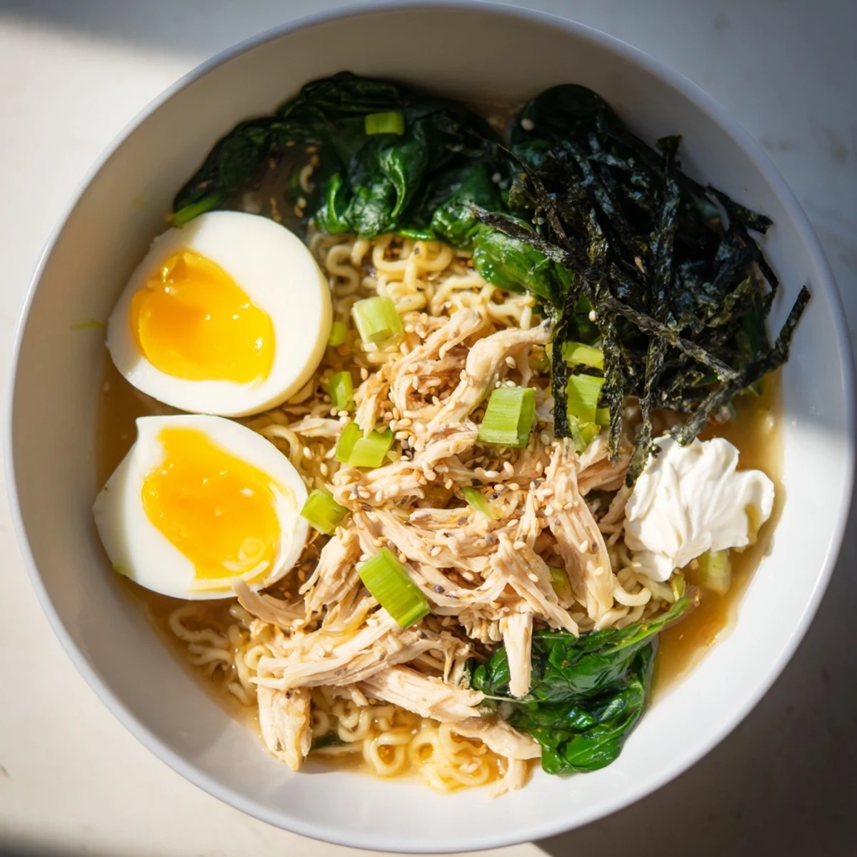 Chicken Ramen with Kewpie Mayo, a steaming bowl of noodles and egg, ready to be enjoyed.