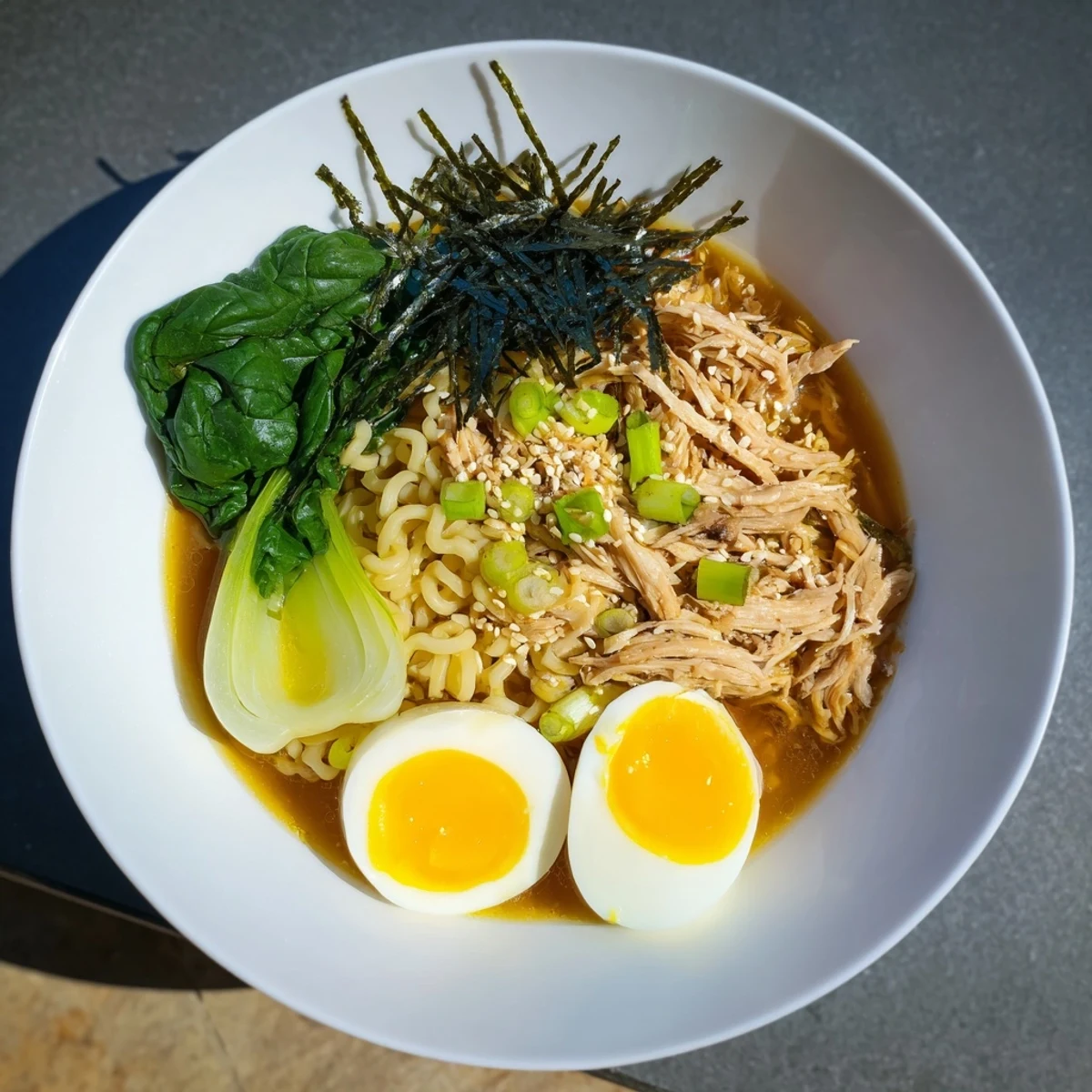 Rich and creamy Chicken Ramen with Kewpie Mayo topped with a soft boiled egg, a delicious meal.