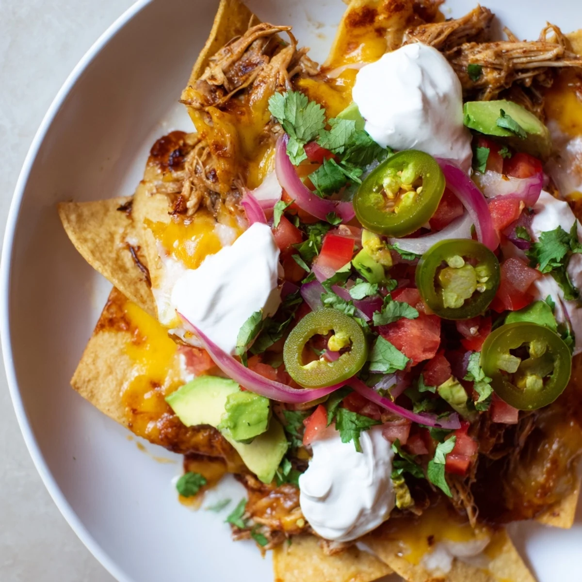 Golden, cheesy Loaded Nachos with tender pulled pork, perfect for sharing and satisfying cravings.