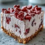 Candy Hearts Fake Cake slice on a plate topped with pastel sprinkles.