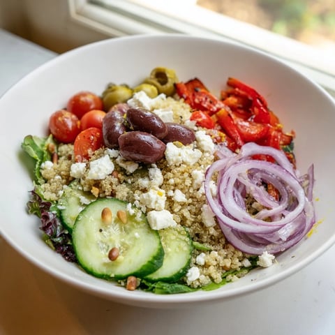 Mediterranean Grain Bowl, showcasing vibrant colors of fresh vegetables and fluffy grains in a bowl.
