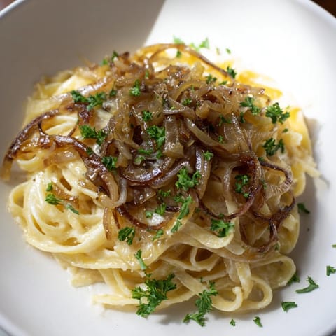 Creamy, cheesy One-Pot French Onion Pasta, ready for a comforting bite from this easy recipe.