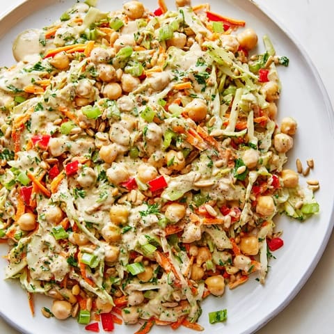 This refreshing Fiber-Forward Chickpea Salad features tender chickpeas and crisp vegetables, ready to eat in minutes.