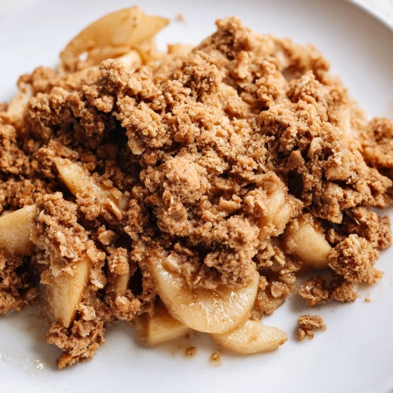 Homemade Spiced Apple Crisp: a warm dessert with a buttery, soft crumb topping.