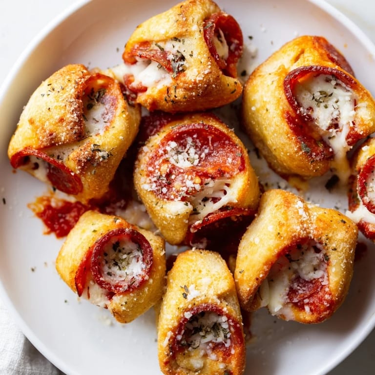 Homemade Air Fryer Pizza Rolls: savory pepperoni, melted cheese, and a flaky, air-fried crust.