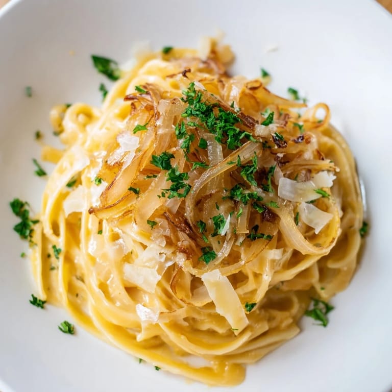 Enjoy the cozy aroma of bubbling cheese and savory broth in this simple One-Pot French Onion Pasta.